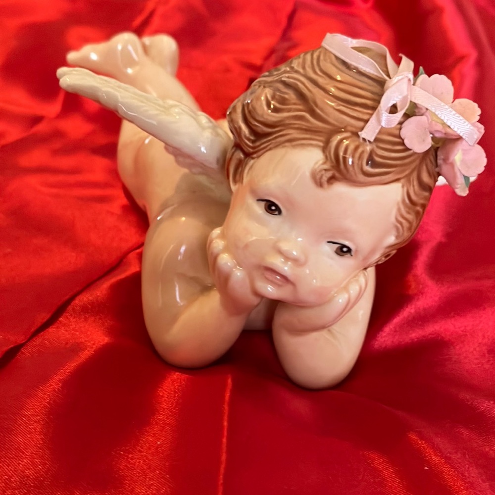 Vintage Ceramic Angel Cherub On his Belly with Flowers and ribbon bow in hair